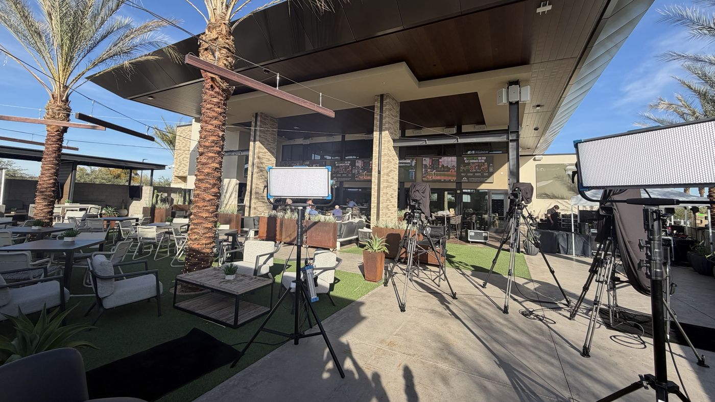 Outdoor camera and lighting set-up under palm trees